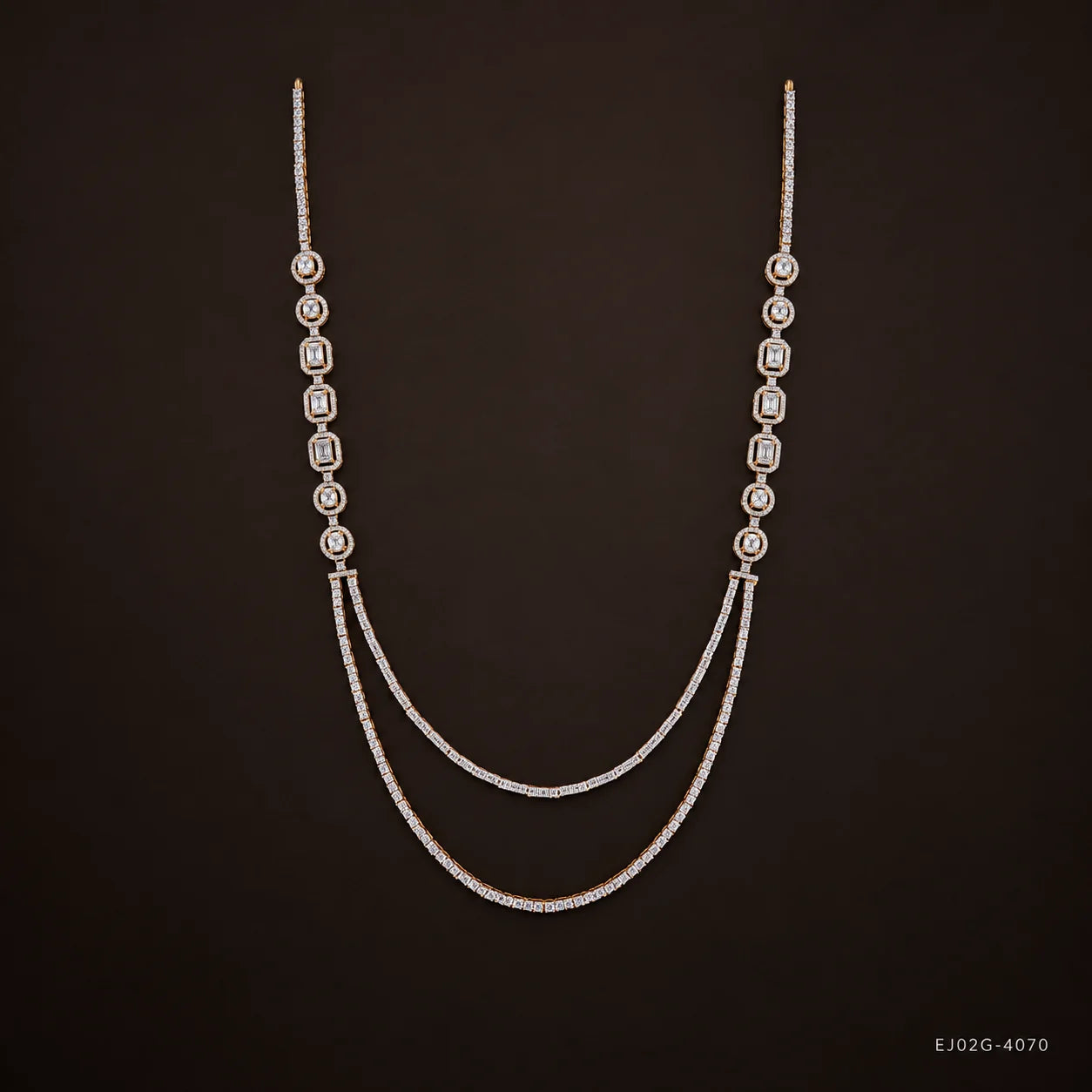 Ira Ethika white long necklace on dark brown background showing bezel-set stones and double-strand drape