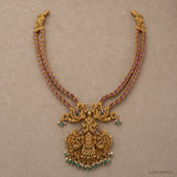 Full view of double strand pink stone long necklace with peacock and deity pendant in antique finish