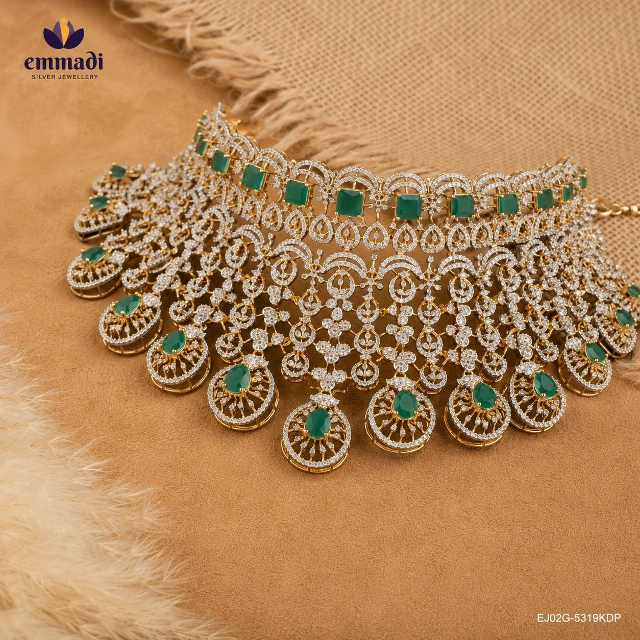 Silver bridal choker necklace with green square stones and cubic zirconia drop pendants displayed on beige fabric