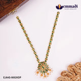 Long green stone necklace with floral pendant and pearl drops displayed beside a wooden box