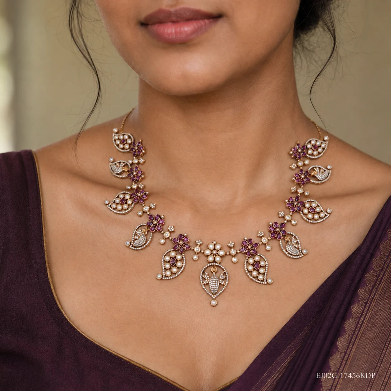 Close-up of neckline showing the Victorian pink necklace with pearl-studded leaf pendants