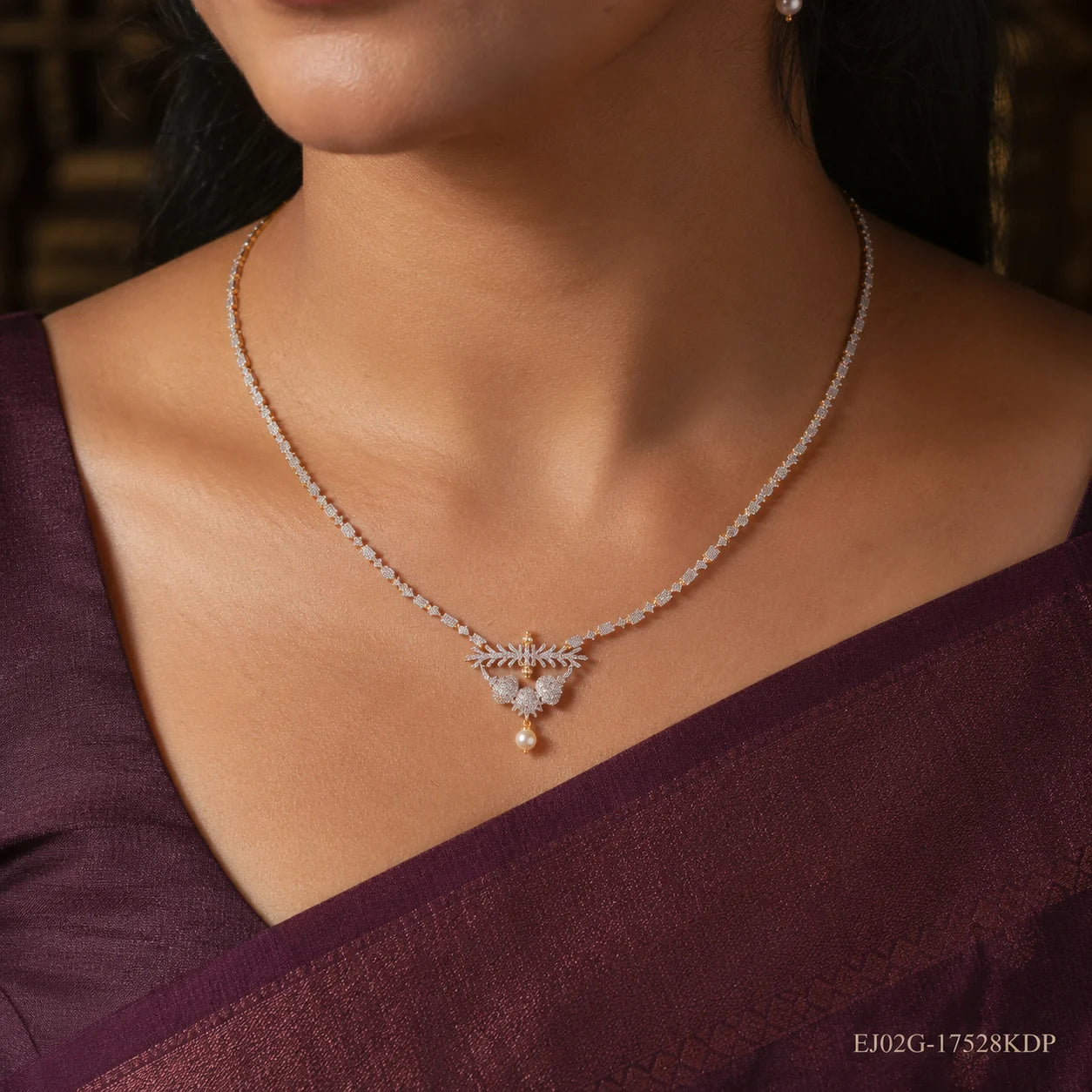 Close-up of the Ethika White Long Necklace worn at the collarbone, showing pave clusters and pearl drop