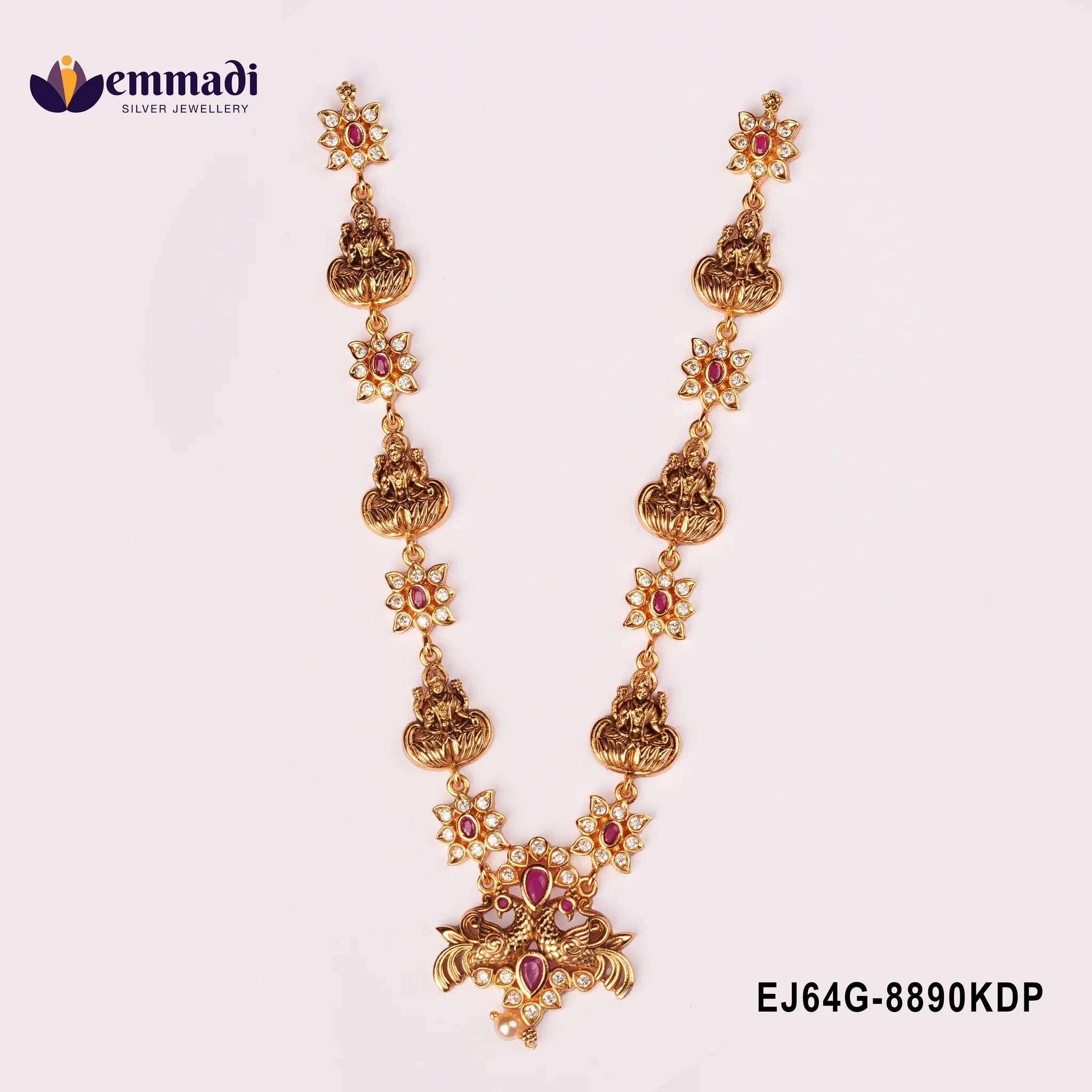 Antique gold nakshi necklace with Lakshmi motifs, floral pink stone links and a peacock pendant with pearl drop