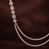 Close-up of the shoulder strap showing alternating round and emerald-cut cubic zirconia in bezel settings