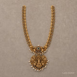 Flat lay of the complete long necklace showing double chain strands and pearl drop fringe pendant