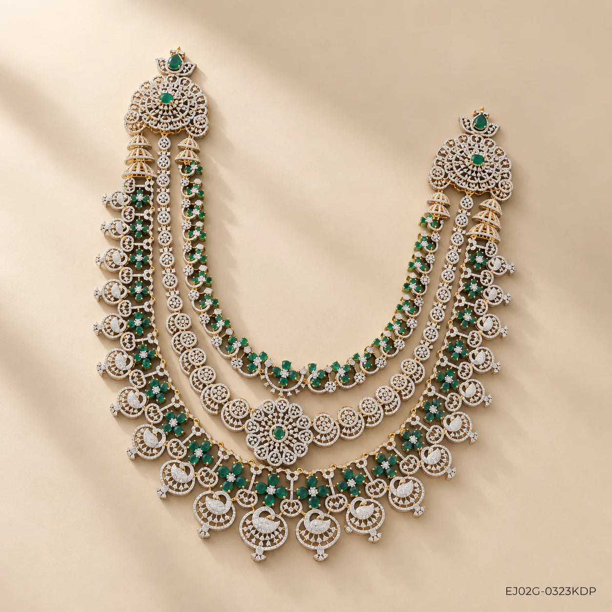 Full view of the green long necklace with shoulder pieces and temple-style drops, lit with soft daylight