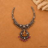 Necklace displayed flat highlighting antique finish chain, white stone work and pearl tassels