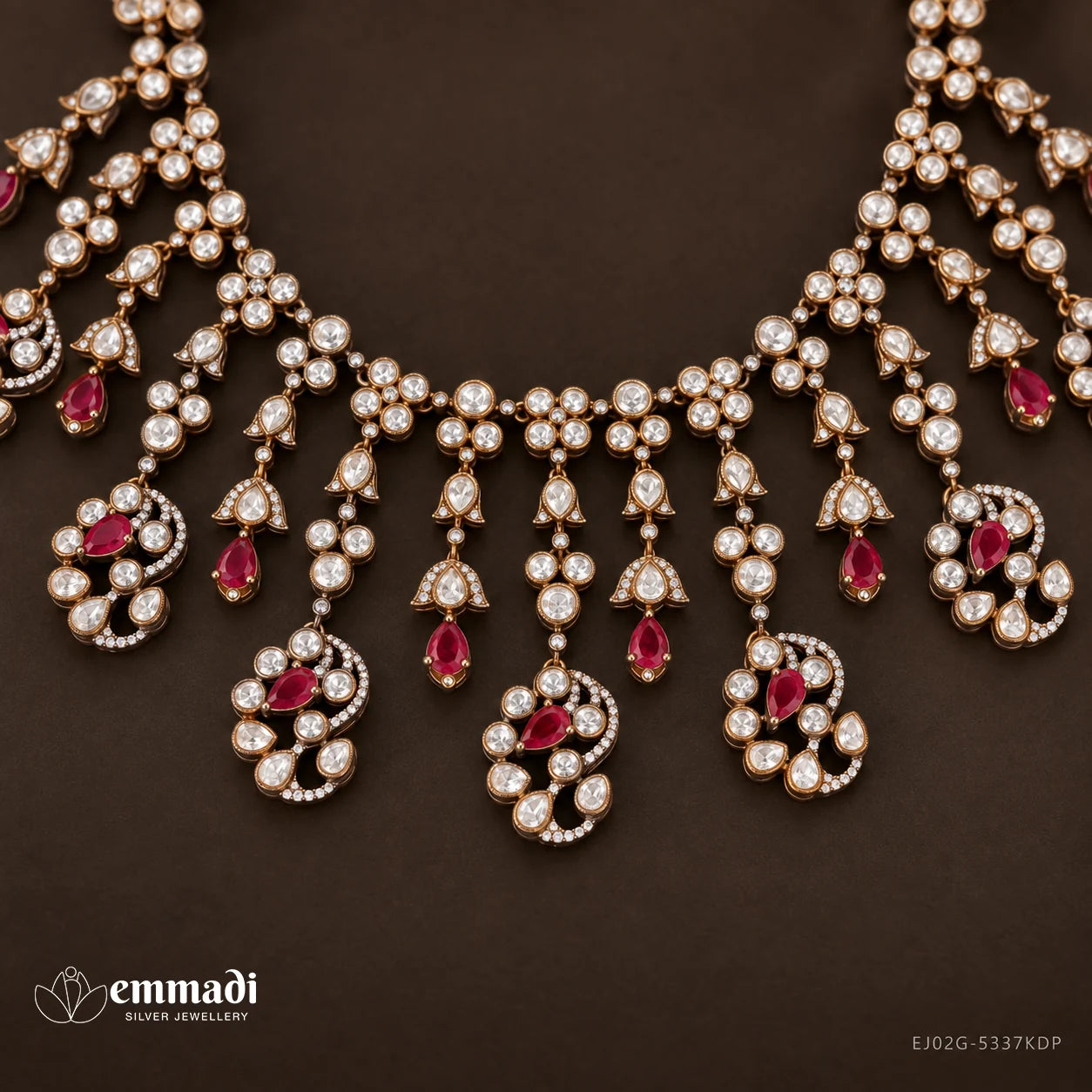 Close up of Victorian necklace drops showing pink pear shaped stones within white stone clusters