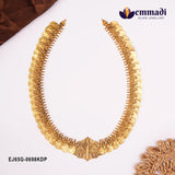 Nakshi antique long necklace with coin medallions laid flat beside brown fabric and Emmadi logo