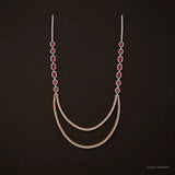 Pink and white stone long necklace with graduated gemstone straps and layered drape, shown on dark background