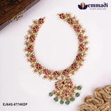 Kundan pink necklace laid flat beside a wooden box, showing pink and white stone work and pearl drops