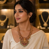 Woman wearing a multicolour Kundan Nakshi long necklace with a carved deity pendant over a cream saree