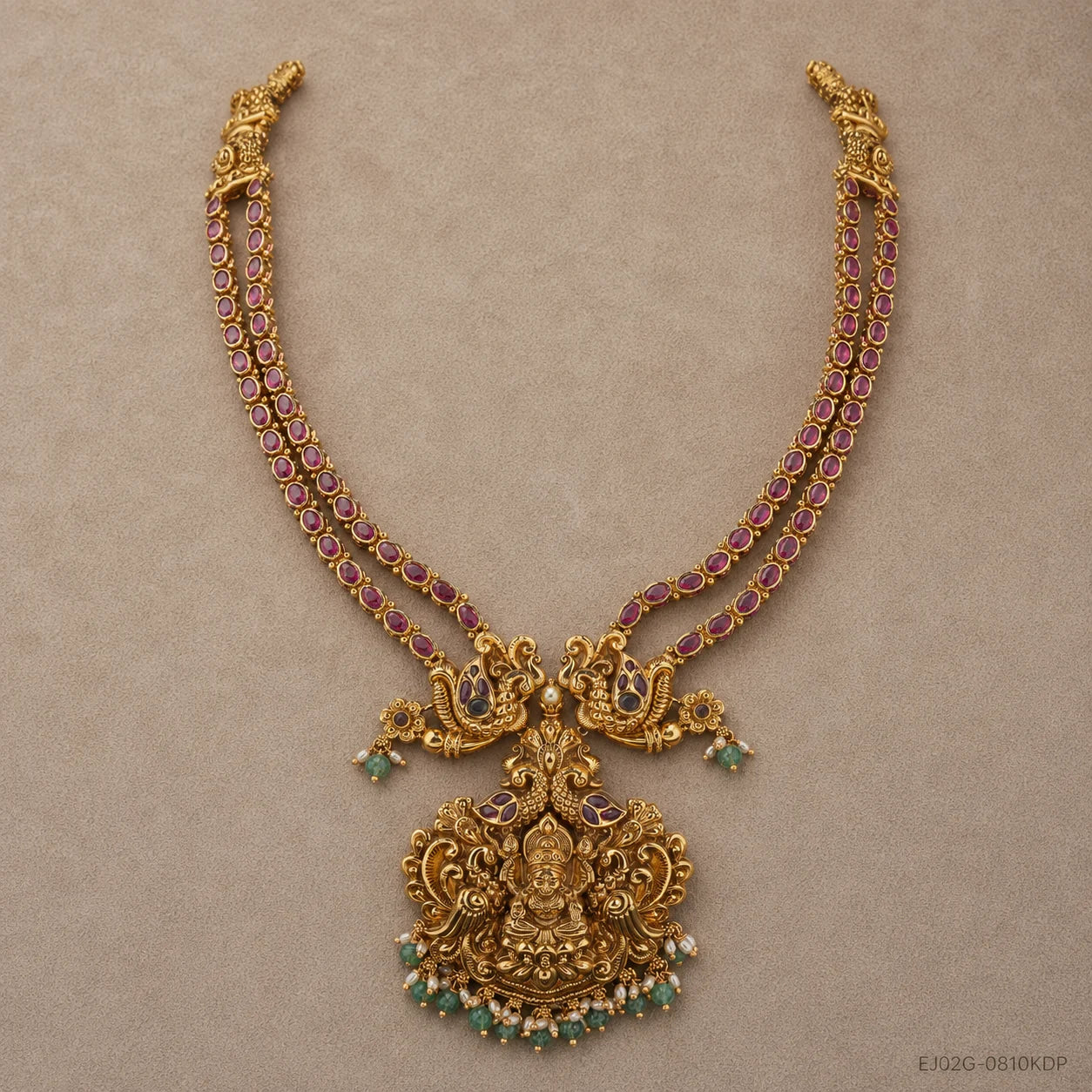 Full view of double strand pink stone long necklace with peacock and deity pendant in antique finish