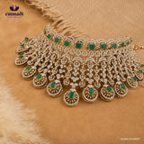 Silver bridal choker necklace with green square stones and cubic zirconia drop pendants displayed on beige fabric