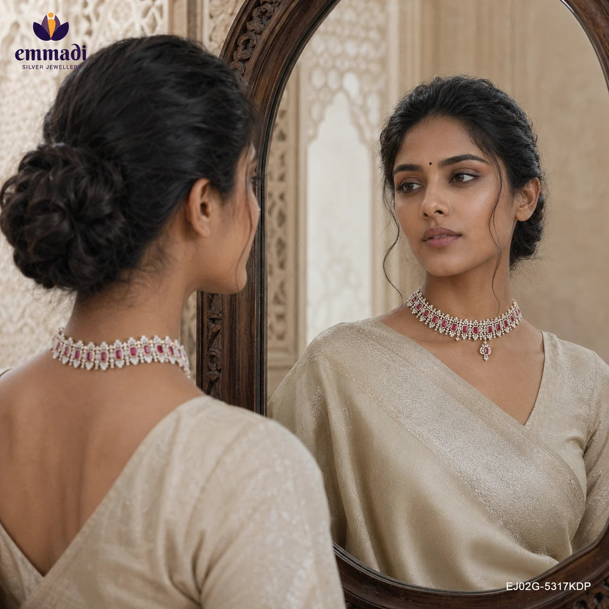 Woman in beige saree seen from behind with a bun, reflected in an arched mirror wearing a pink and white CZ choker