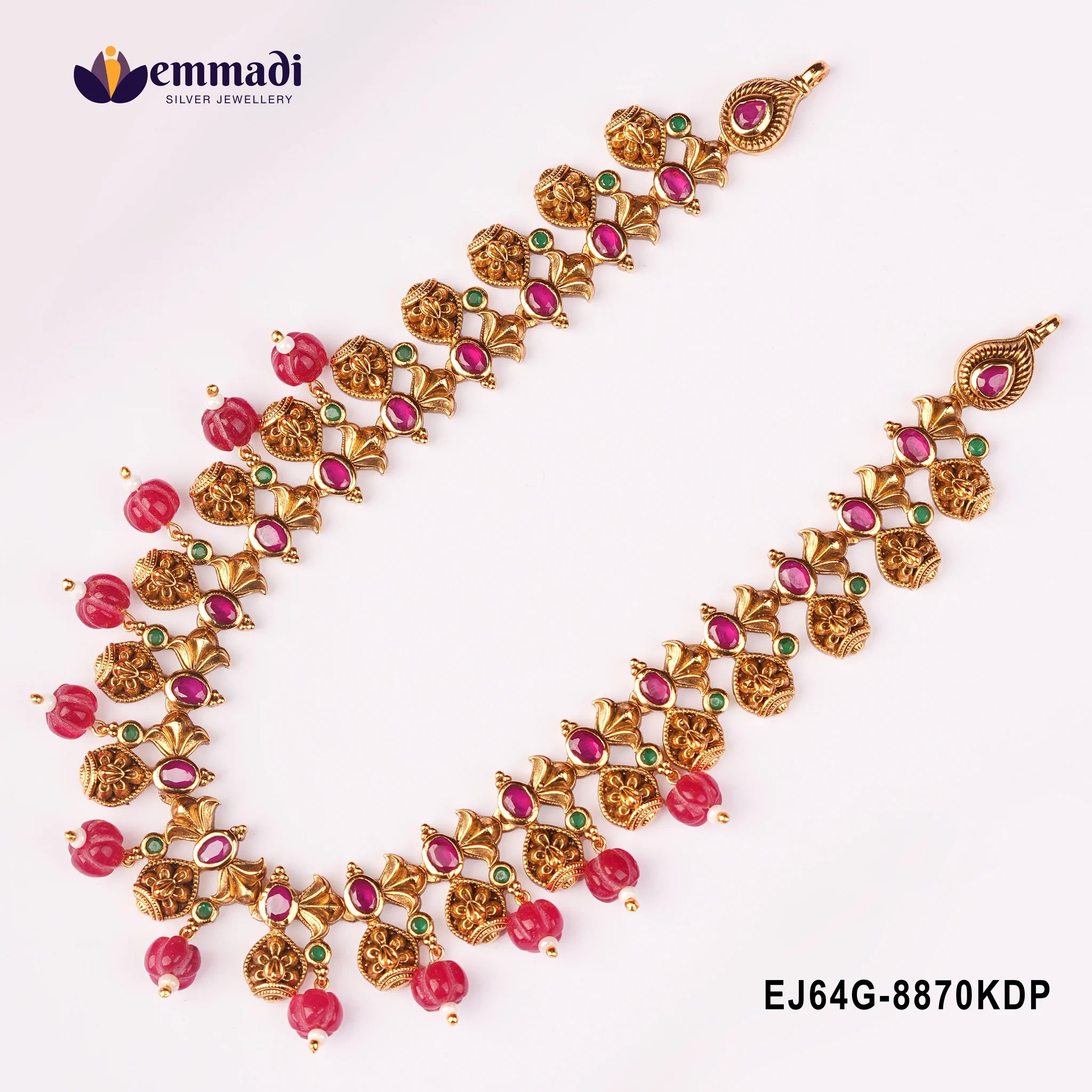 Close view of the multicolour stone necklace on a plain background, highlighting pink and green stone settings