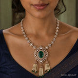Close-up of the Ira Victorian green necklace showing the floral cluster chain and central green stone pendant