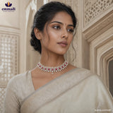 Close-up of a woman in a beige saree wearing a pink and white CZ pave choker, looking to the side