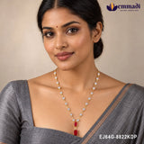 Woman in grey saree wearing the pink stone pendant necklace with heart pave chain for festive styling