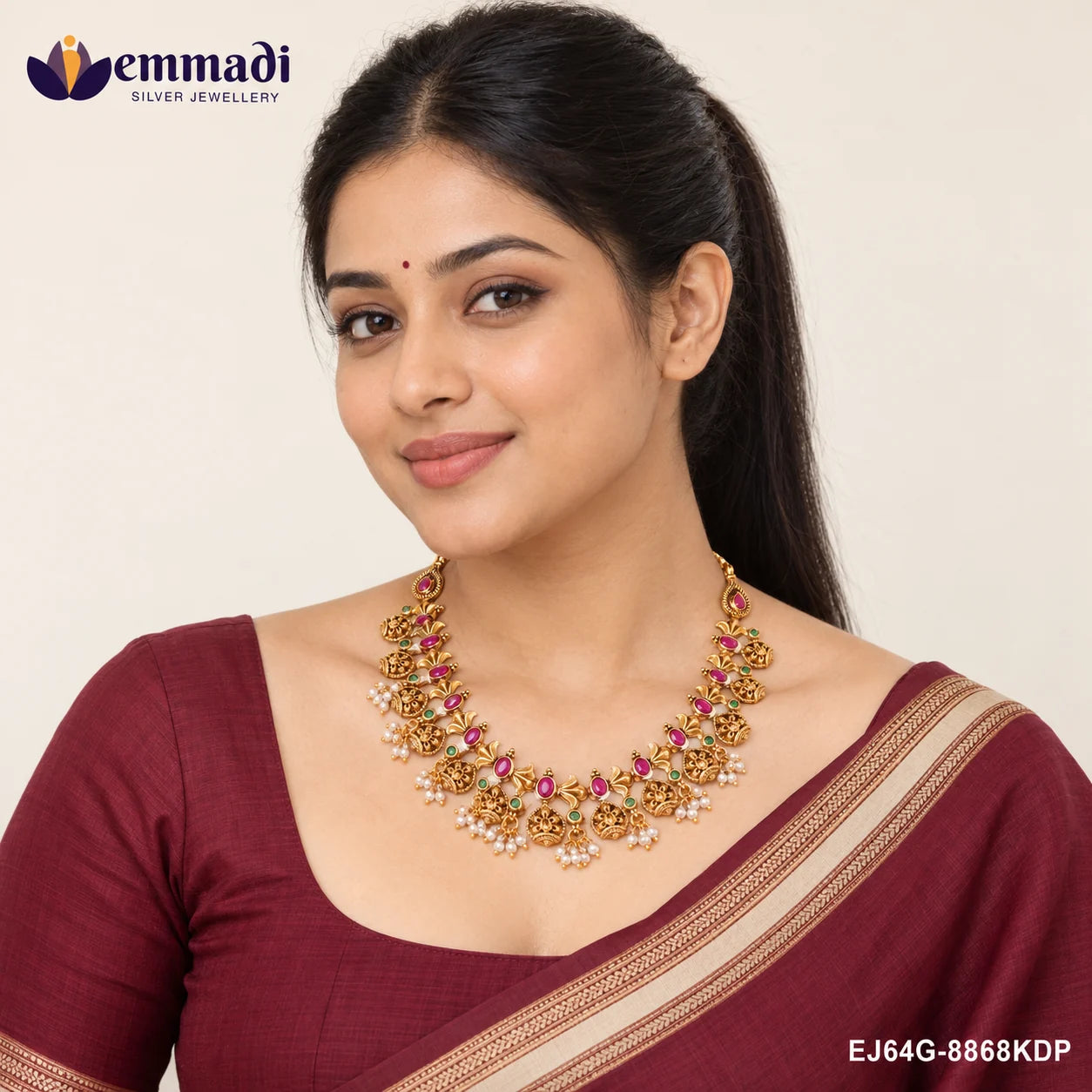 Woman wearing the multicolour stone necklace with a maroon saree and matching blouse