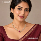 Woman in maroon saree wearing the Ethika Red Necklace with white stone florals and red centre stone