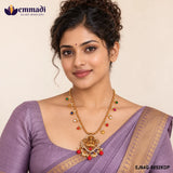 Woman wearing the Nakshi multicolour necklace with a purple saree at the neckline