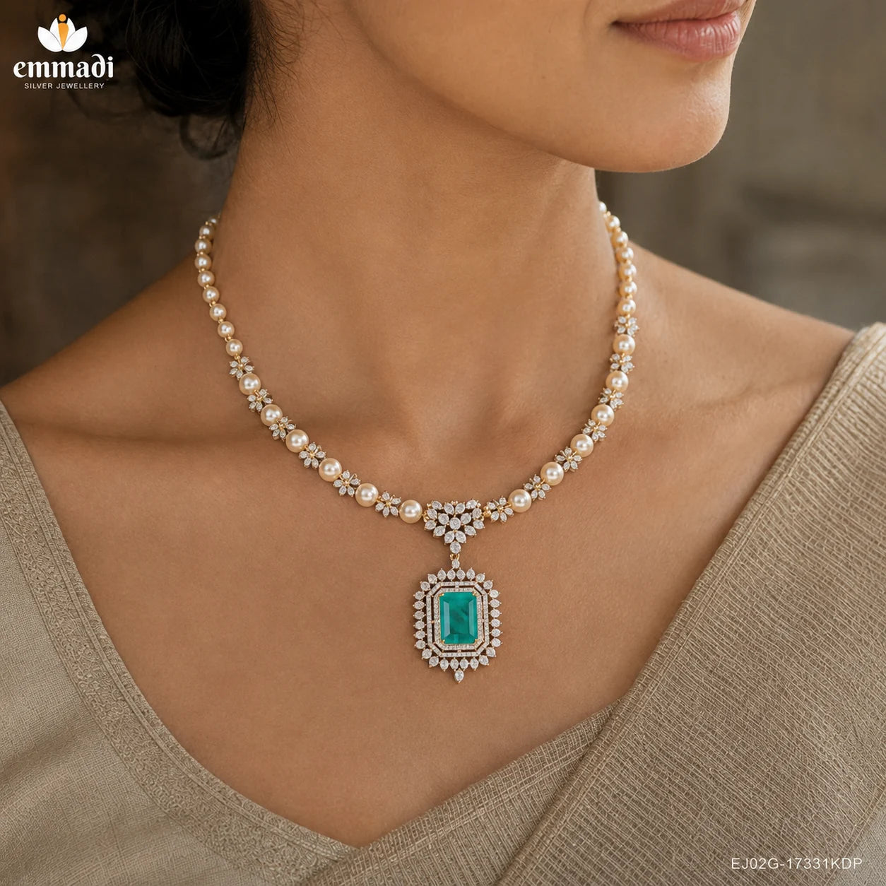 Detailed view of the neckline showing pearl beads, pave CZ links and the green stone pendant