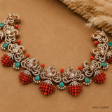 Flat lay of the Victorian necklace on beige fabric showing the full design with coral clusters and green stones