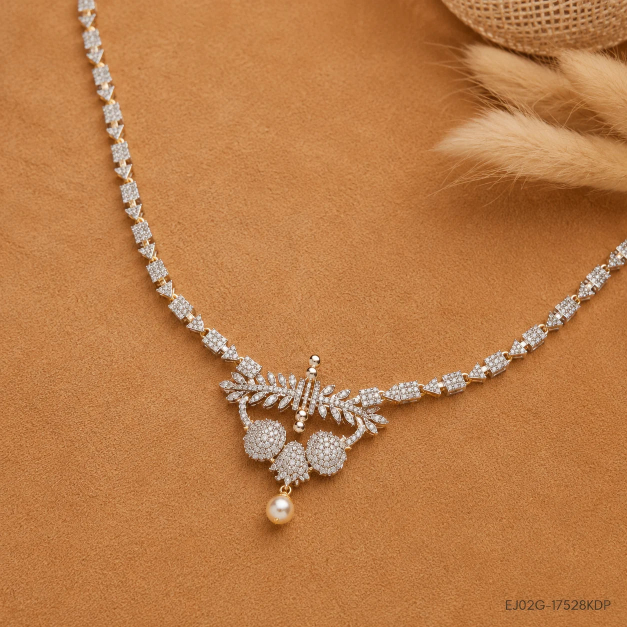 Flat lay of the Ethika White Long Necklace pendant detail on a tan fabric background