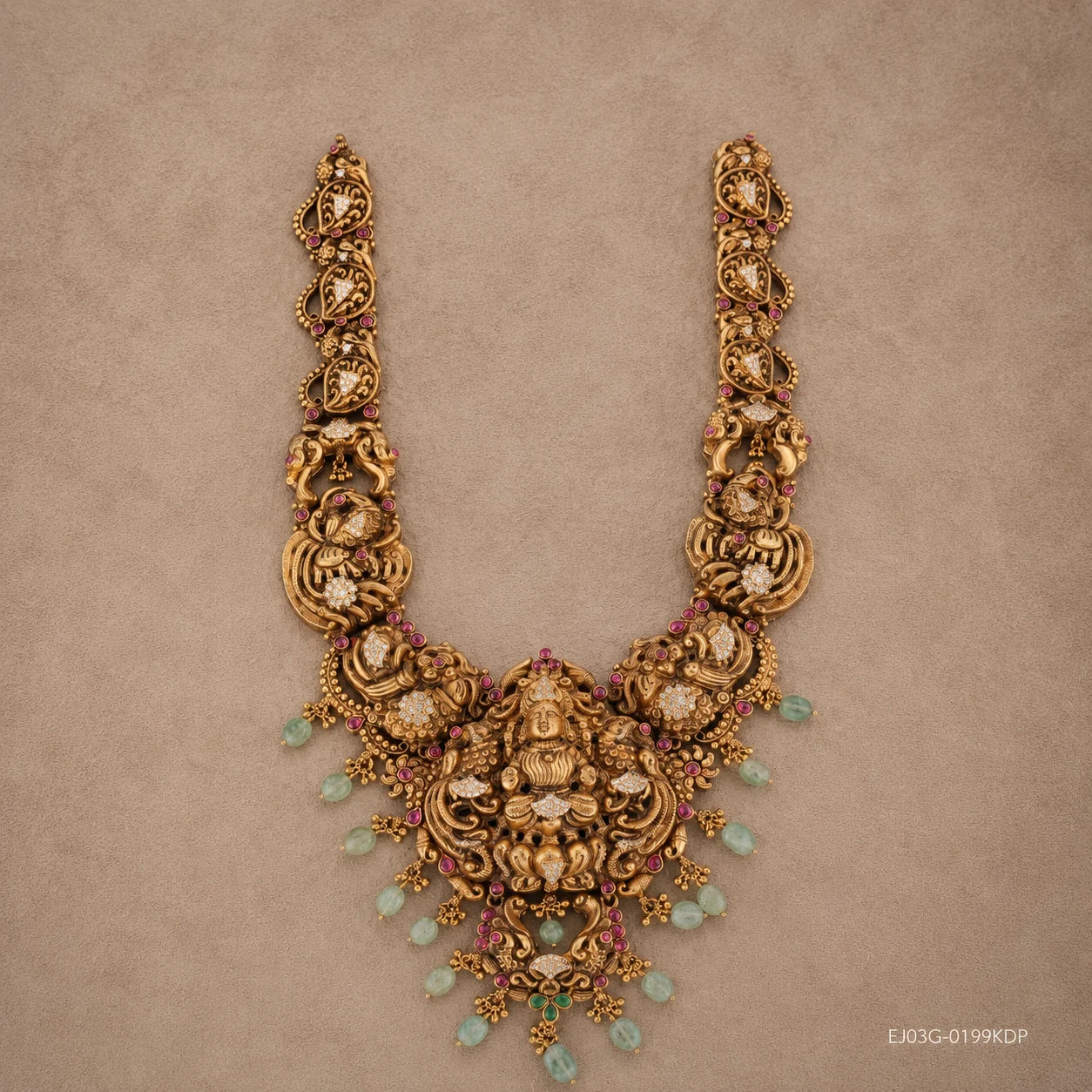 Full flat-lay view of the Kundan Nakshi long necklace showing its U-shaped design and green bead drops