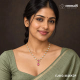 Woman in a green saree wearing the pink CZ necklace with pendant resting at the neckline