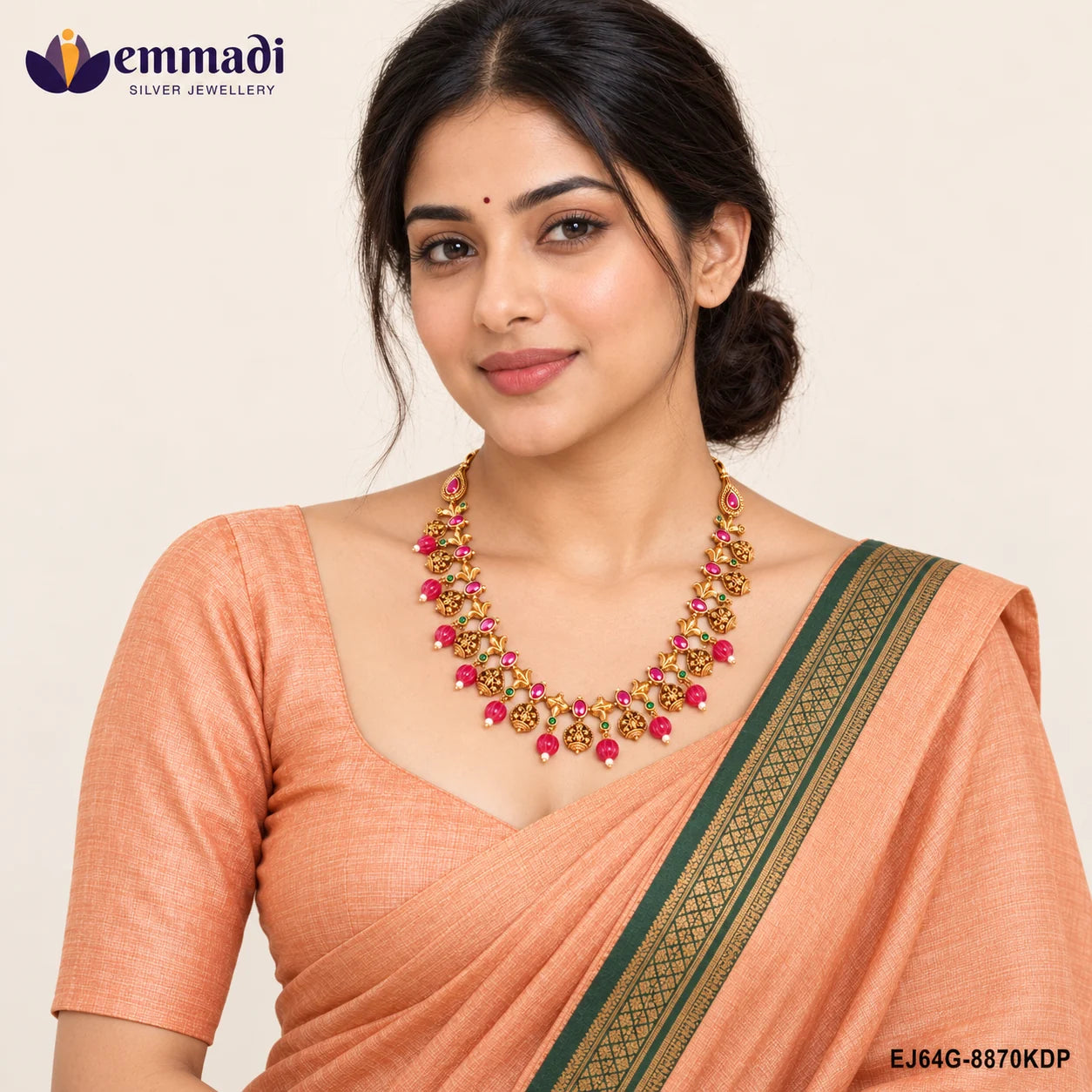 Woman in an orange saree wearing the multicolour stone necklace with teardrop pendant ends