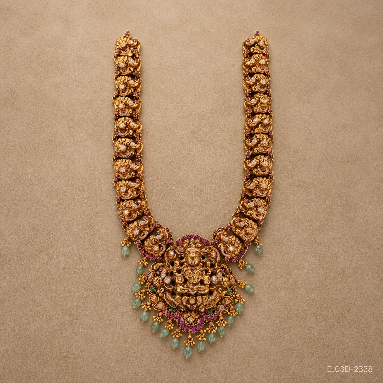 Full view of the long necklace laid flat showing the nakshi link pattern on both sides