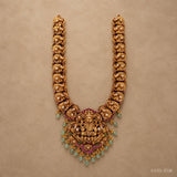 Full view of the long necklace laid flat showing the nakshi link pattern on both sides