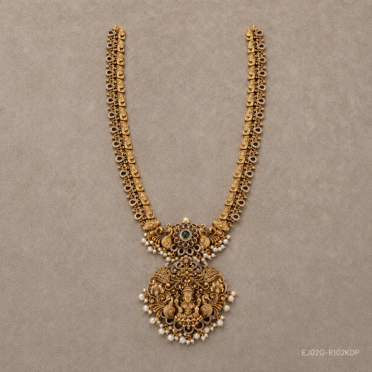 Flat lay of the complete long necklace showing double chain strands and pearl drop fringe pendant