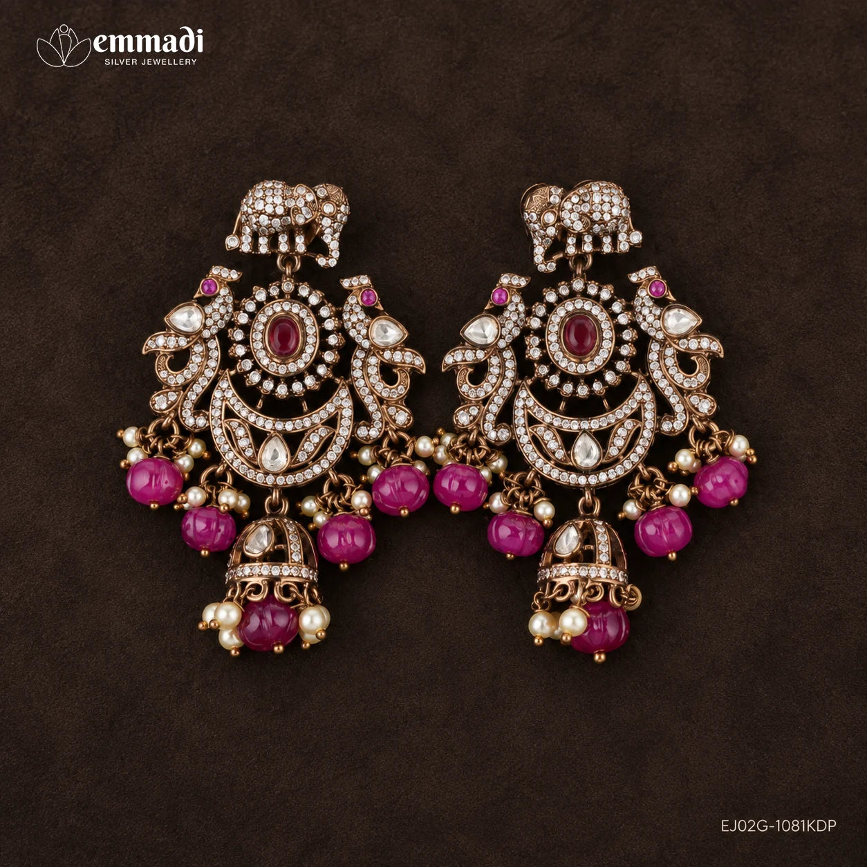 Front facing pair of Victorian red hangings with matching elephant studs on dark background