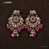 Front facing pair of Victorian red hangings with matching elephant studs on dark background