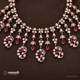 Close up of Victorian necklace drops showing pink pear shaped stones within white stone clusters