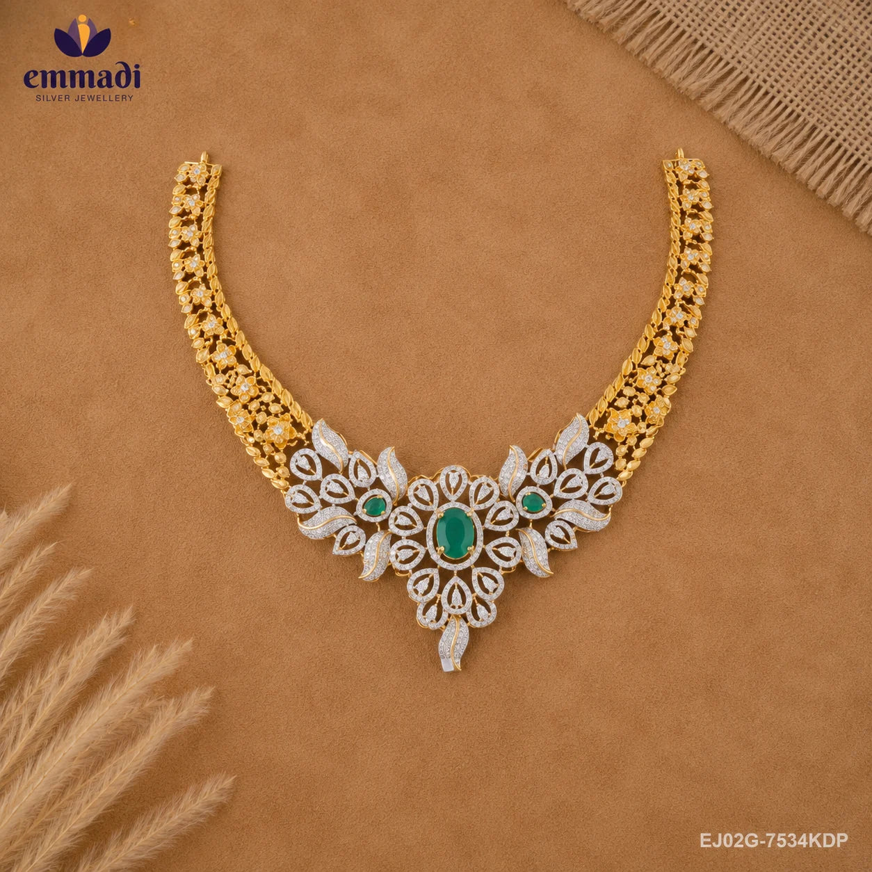 Necklace laid flat on tan fabric styled with dried grass stems, highlighting the detailed craftsmanship